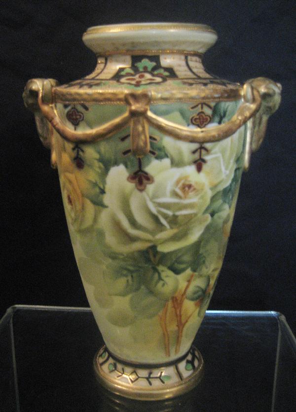 Nippon Green M with wreath 9" yellow rose decorat: Nippon Green M with wreath 9" yellow rose decorated vase with ram head handles and gold embossed garlands. Minor gold wear.