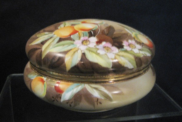 Nippon Green M with wreath 7 1/2" covered dresser: Nippon Green M with wreath 7 1/2" covered dresser box with fruit and floral decoration.