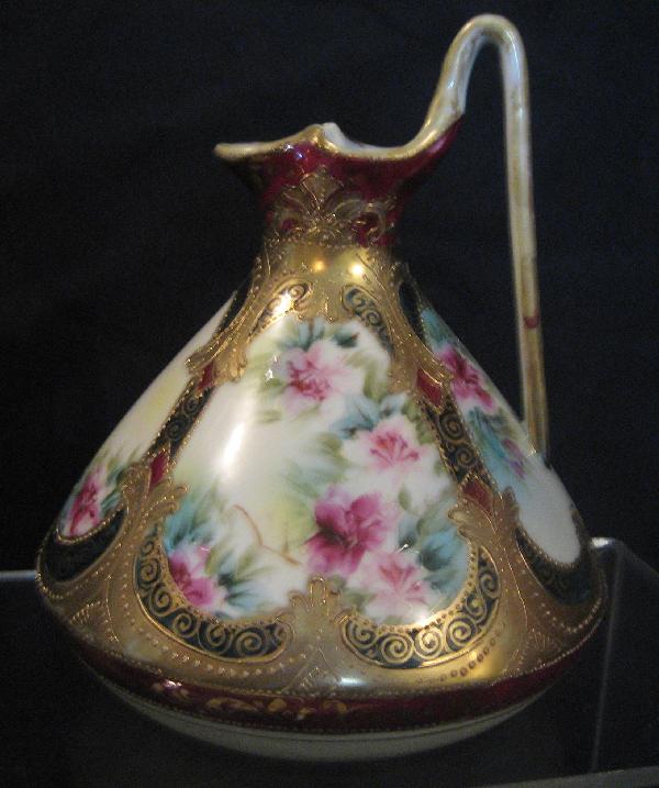 Nippon Blue maple leaf 7 1/2" gold and floral : Nippon Blue maple leaf 7 1/2" gold and floral decorated ewer. Gold wear on handle and rim.