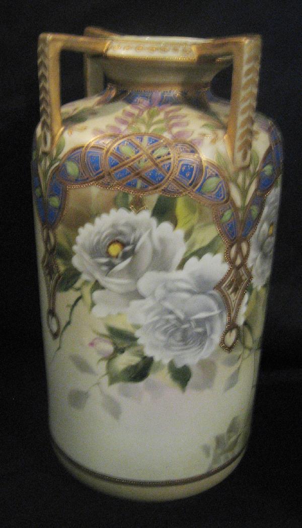 Nippon Green M with wreath 11 3/4" vase with white: Nippon Green M with wreath 11 3/4" vase with white roses and geometric design. Heavy gold beading.