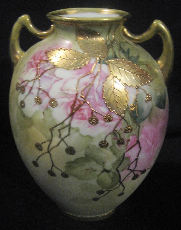 Nippon Blue maple leaf 8 7/8" rose decorated vase: Nippon Blue maple leaf 8 7/8" rose decorated vase with gold leaf and berry overlay. Gold wear on handle and rim.