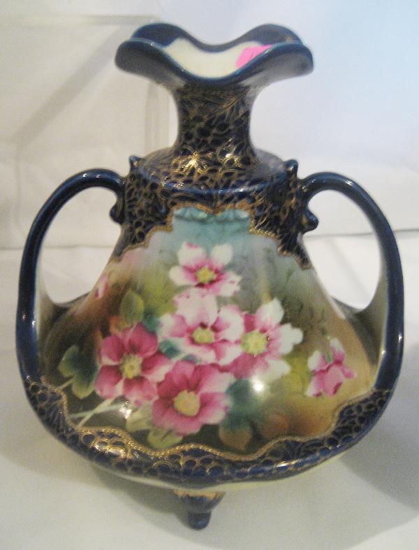 Unmarked Nippon 8 1/2" cobalt and gold floral: Unmarked Nippon 8 1/2" cobalt and gold floral decorated footed 2-handle vase with ruffle top
