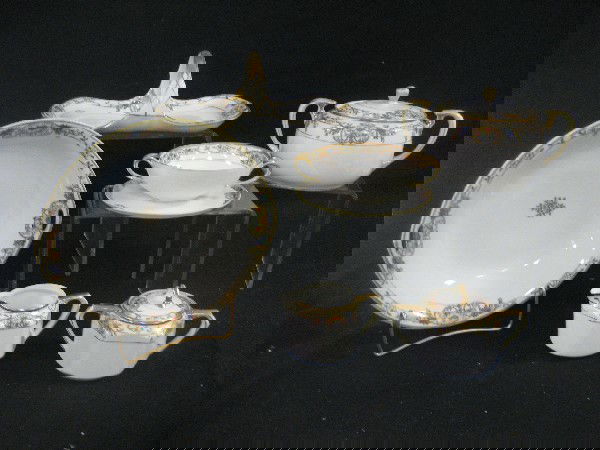 Nippon Magental M with wreath china with art deco: Nippon Magental M with wreath china with art deco floral and gold design. Covered sugar and creamer, bullion cup and tray, cracker jar, lg. flat basket, lg. handled bowl, lg. round platter, shallow bo