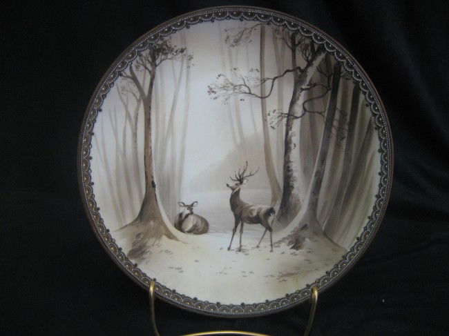 Nippon Green M with wreath 10 1/4" plaque showing d: Nippon Green M with wreath 10 1/4" plaque showing deer in a forest scene. Beaded border.