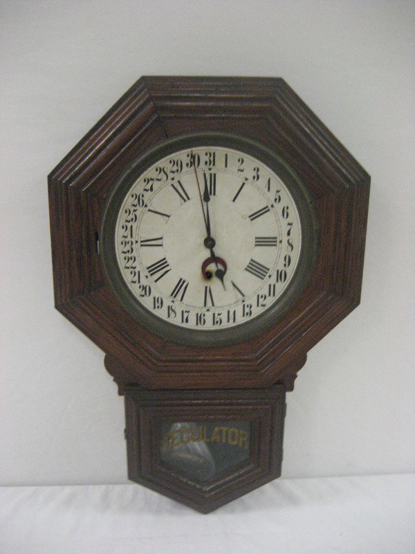 Walnut Sessions Regulator Calendar clock.: Walnut Sessions Regulator Calendar clock. 23 1/2" tall, 15 1/2" wide, 3 3/4" deep.