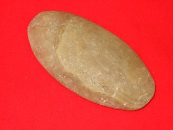 4 1/4" yellow quartz gorget. Found in Glovers Cav: 4 1/4" yellow quartz gorget. Found in Glovers Cave, Christian County, KY