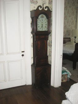 C. 1825 New England mahogany tall case clock. 83 1: C. 1825 New England mahogany tall case clock. 83 1/2" tall, 18 3/4" wide at base. Originally from the shop of Antiques dealer Clifton Anderson, with original purchase receipt. Replaced finial, some lo