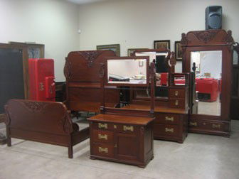 Outstanding four piece Mahogany bedrooms suite with: Outstanding four piece Mahogany bedrooms suite with carved tear drop panels with leaf and berry carvings, floral rosettes, and ornate brass pulls. Bed is 73 3/4" tall, 79" long, 64 3/8" wide (56" inte