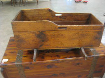 Early pine cradle with replaced board on one side.: Early pine cradle with replaced board on one side. 16" tall, 31 3/4" long, 24" wide.