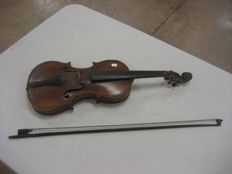 Violin and bow. Violin marked "Antonius Stradivar: Violin and bow. Violin marked "Antonius Stradivarius Cremonensis Faciebot Anno 1718" on interior.