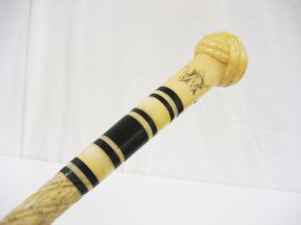 Cane/walking stick: Spiral carved ivory shaft with: Cane/walking stick: Spiral carved ivory shaft with ebony and ivory Turk's cap handle with initials "WR". 34 5/8" overall length.