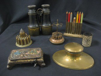 Grouping: Brass oval inkwell with insert, brass r: Grouping: Brass oval inkwell with insert, brass rectangular inkwell with dragon and oriental characters (one side of pin holder missing), trench art bullet paperweight marked Vickers Sons & Maxim Ltd.