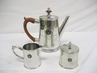 Steiff Pewter Old Stourbridge Village coffee servi: Steiff Pewter Old Stourbridge Village coffee service with 8 1/2" pot, creamer and sugar, all with Amateur Trapshooting Association logo. "Spring Grand American Singles Championship Champion 1984"
