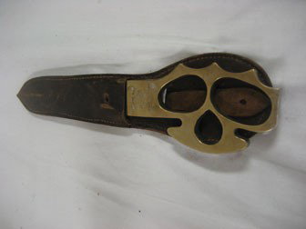 Judphar City Volunteer Corps 1957 "Knuckle Knife".: Judphar City Volunteer Corps 1957 "Knuckle Knife". English made knives for the April 22nd, 1957 wedding of Princess Judphar, given to and worn by the Guards. With original sheath.