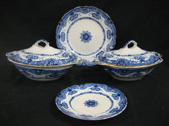 Emprie Works flow blue china: (6) 9 1/2" plates;: Emprie Works flow blue china: (6) 9 1/2" plates; (3) 7" plates - wone with crazing, one with spotting; (2) 11 1/2" covered vegetables - one with minor glaze blemish on one handle.