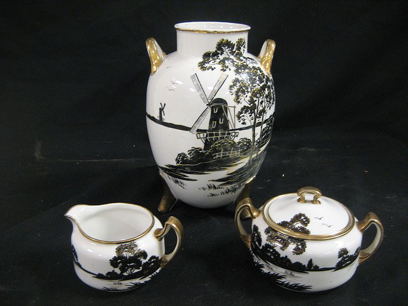 Nippon blue maple leaf cramer and covered sugar wi: Nippon blue maple leaf cramer and covered sugar with black and gold scenic decoration on white - gold wear; with 9 1/4" ovoid two handle footed vvase with black windmill scene with yellow highlights.