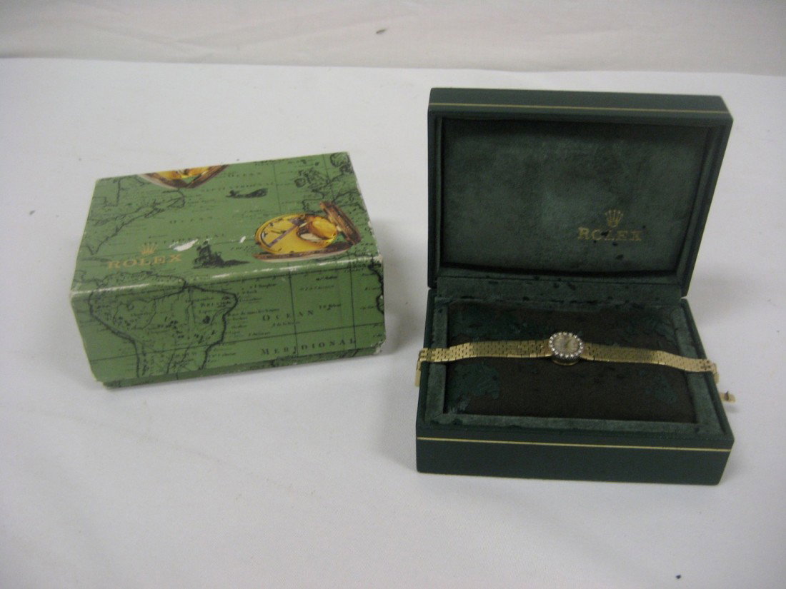 Ladies 14k Rolex wrist watch with diamond bezel.: Ladies 14k Rolex wrist watch with diamond bezel.