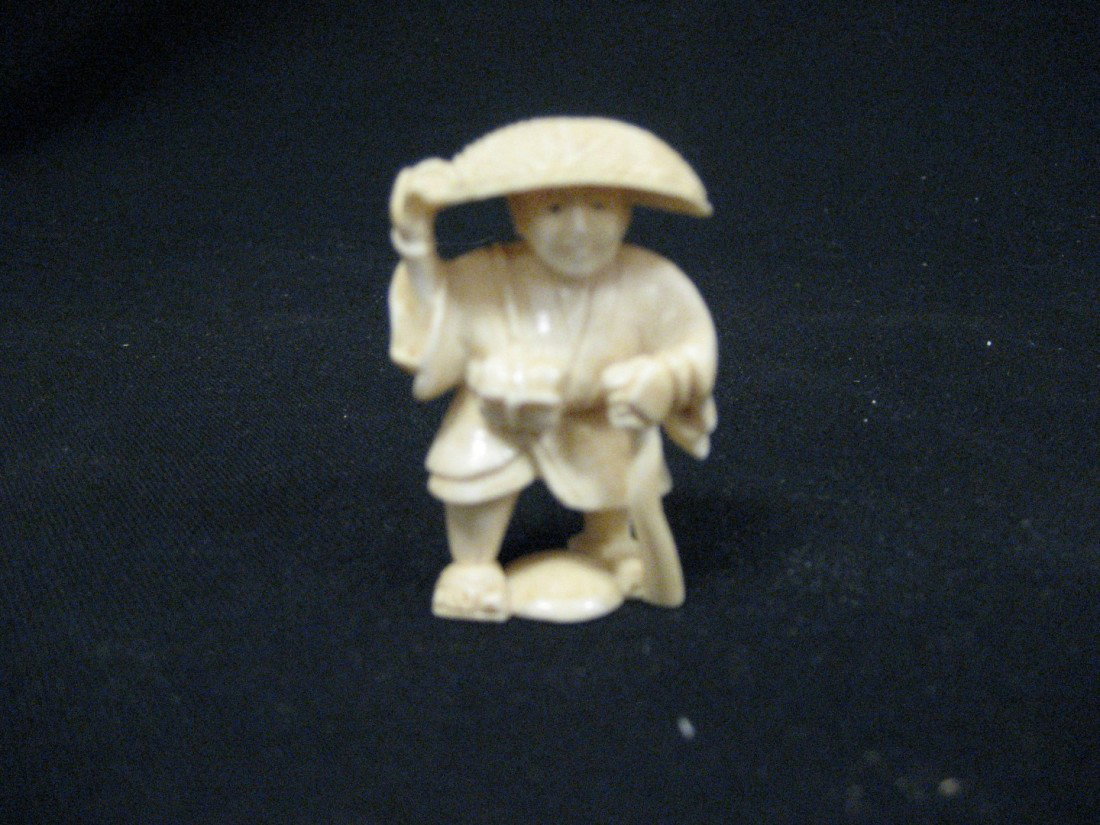 Netsuke of a man with a hat, app. 2". : Netsuke of a man with a hat, app. 2".