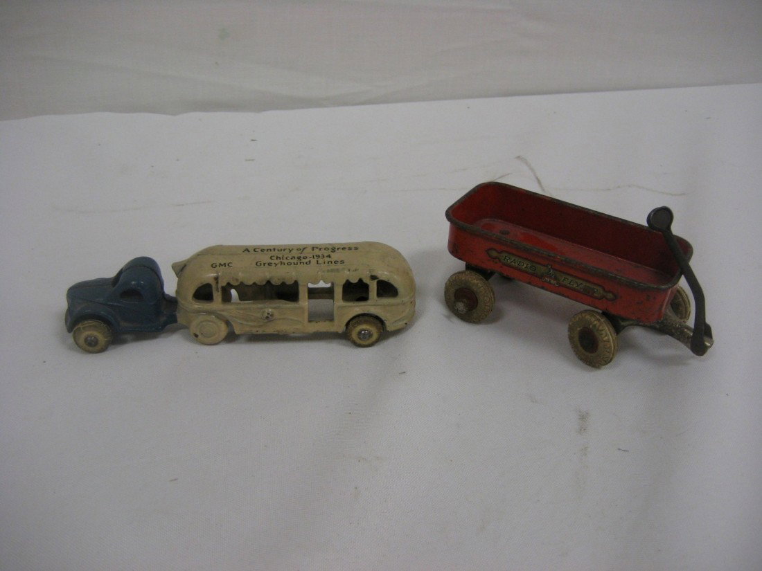 1934 Chicago World's Fair: GMC Greyhound Lines 5 : 1934 Chicago World's Fair: GMC Greyhound Lines 5 5/8" bus "A Century of Progress", Radio Flyer wagon app. 3 7/8", with Fair sticker. Some wear.