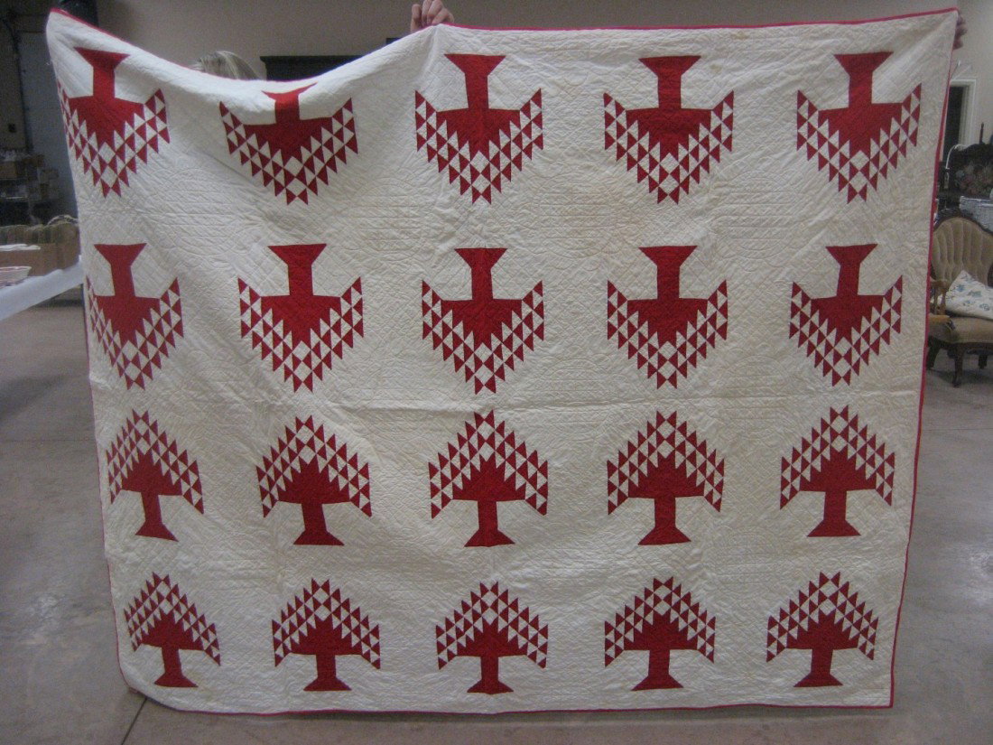 Red Tree quilt: Red Tree quilt. App. 69 1/2" X 83 1/2". Three minute holes found in white front of quilt; minor yellow staining and discoloration. Still a dandy!