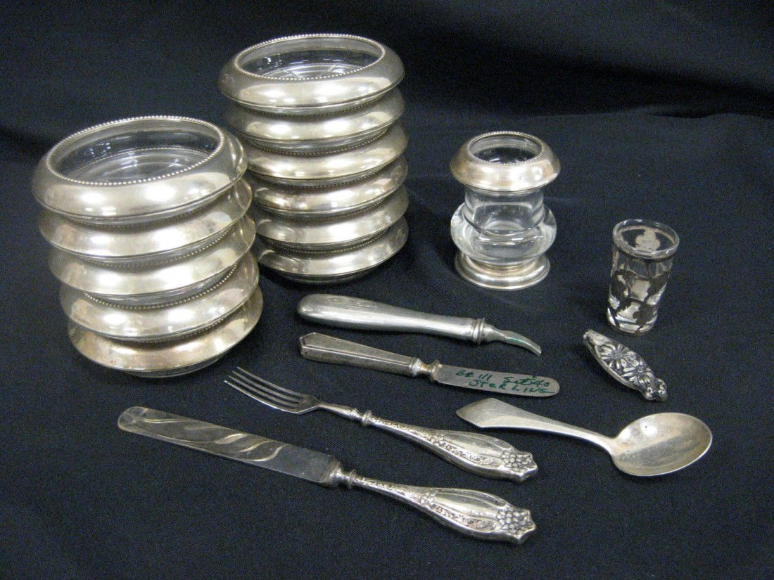 (11) sterling and crystal coasters, sterling and c: (11) sterling and crystal coasters, sterling and crystal toothpick, 925 silver overlay shot glass, sterling andle youth set, sterling spoon, sterling handle knife, 2 pcs. Scrap sterling.