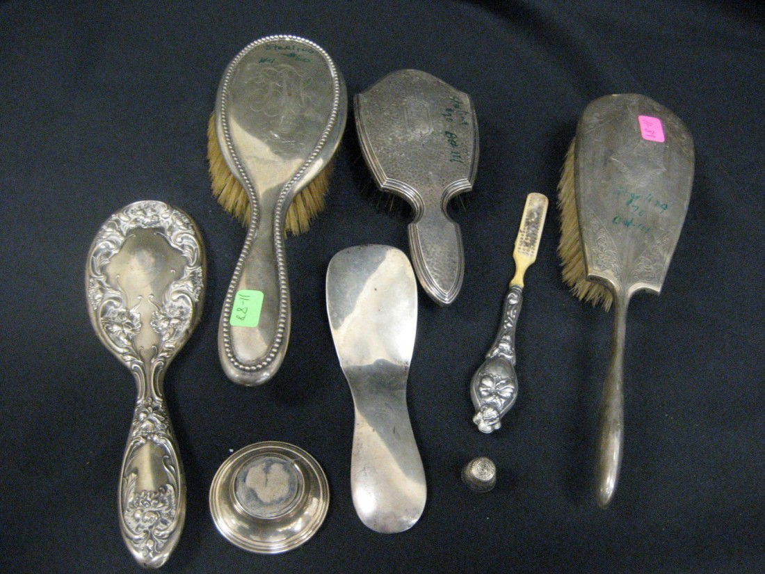 Sterling embossed hand mirror, British sterling pi: Sterling embossed hand mirror, British sterling pin cushion (worn cover), heavy sterling shoehorn, beaded sterling hand mirror, hammered sterling brush with monogram, sterling brush, sterling handle t
