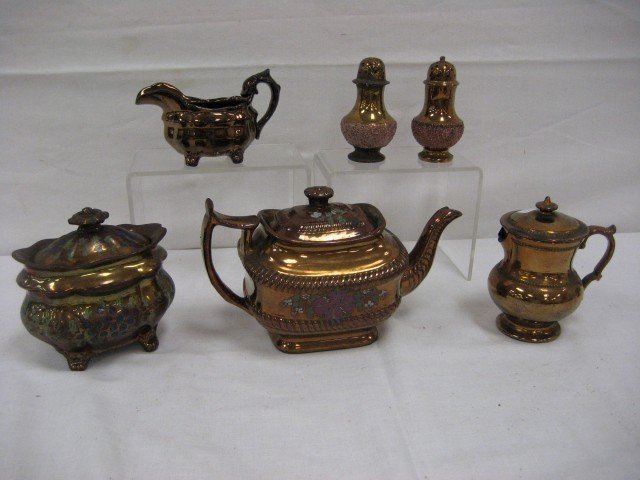 Copper lustre: 5 3/4" covered master sugar, repai: Copper lustre: 5 3/4" covered master sugar, repair in body, chip on rim and inner lid with enamel grape, leaf and flower decoration; 3 1/8" creamer; 5 5/8" covered pitcher with beading, loss on spout,