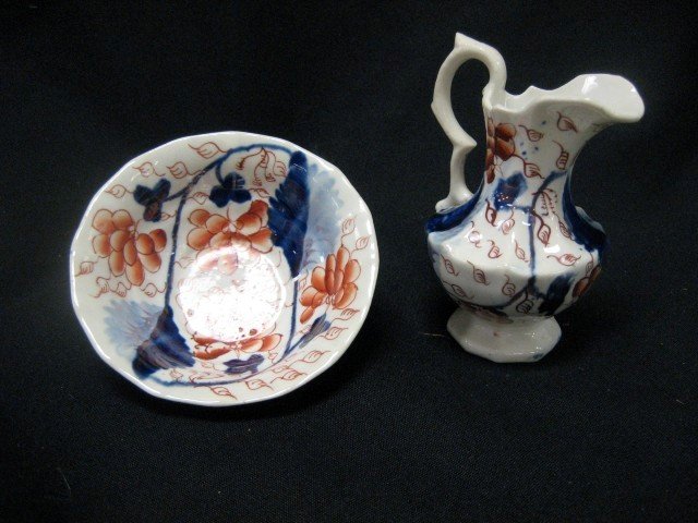 Gaudy Ironstone miniature bowl and pitcher. Bowl : Gaudy Ironstone miniature bowl and pitcher. Bowl is 4" wide, 1 1/2" tall, pitcher is 4 3/8" tall. Crazing, line at pitcher lip.