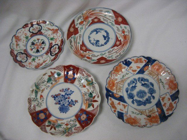 Four (4) Imari style plates: 8 1/2" with center v: Four (4) Imari style plates: 8 1/2" with center vase/basket and scalloped edge; 8 1/2" with floral design and scalloped border, with minor imperfections in the body; 7 1/4" with center floral design a