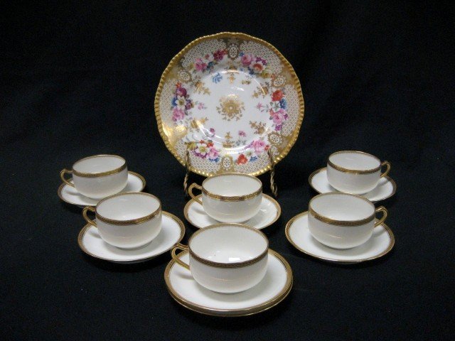 Haviland & Co. Limoges "Marquis" set of 6 cups and: Haviland & Co. Limoges "Marquis" set of 6 cups and 7 saucers; 9" gold and floral plate marked D&Co. France and L. Bernardaud & Co. Limoges.