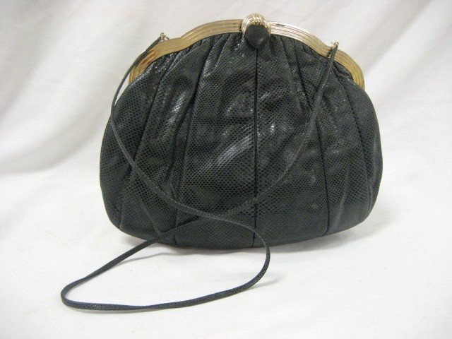 Judith Lieber eel/snake skin purse with accessorie: Judith Lieber eel/snake skin purse with accessories. Wear on metal trim, minor wear on purse, 10" tall