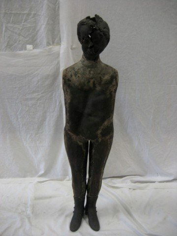 Papier Mache mannequin, 46" tall, with iron boots: Papier Mache mannequin, 46" tall, with iron boots. Damaged head and face.