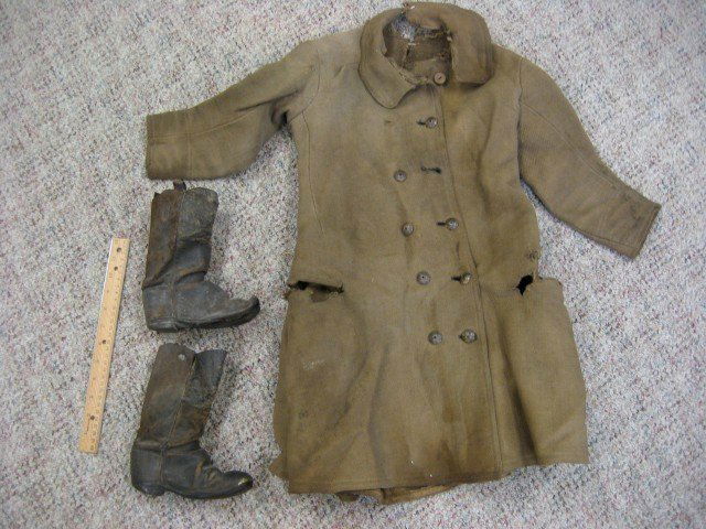 Confederate Drummer boy frock coat and boots. Bo: Confederate Drummer boy frock coat and boots. Boots with square nail bottoms, metal toe, and one remaining leather pull strap, with original butting fastener at top of coat. Expected loss, wear and da