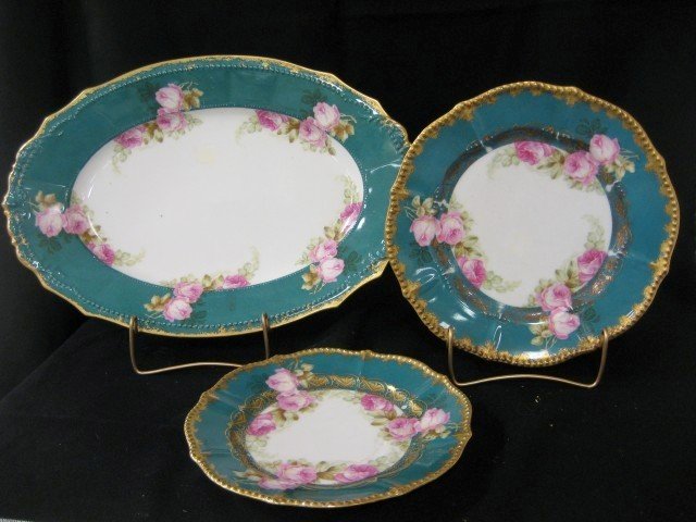 P&B Limoges Elite Limoges rose decorated china wit: P&B Limoges Elite Limoges rose decorated china with heavy gold border. 16 1/4" platter with back rim chips, (2) 8 1/2" plates with wear and back chips, (2) 9 5/8" plates with wear and back rim nick/ch
