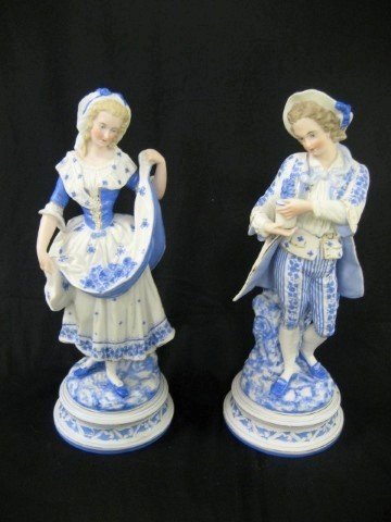 Pair French bisque figurines, young man and lady w: Pair French bisque figurines, young man and lady with blue and white mille fleur decoration in the Marie Antoinette taste, c. 1890. Minor gold wear