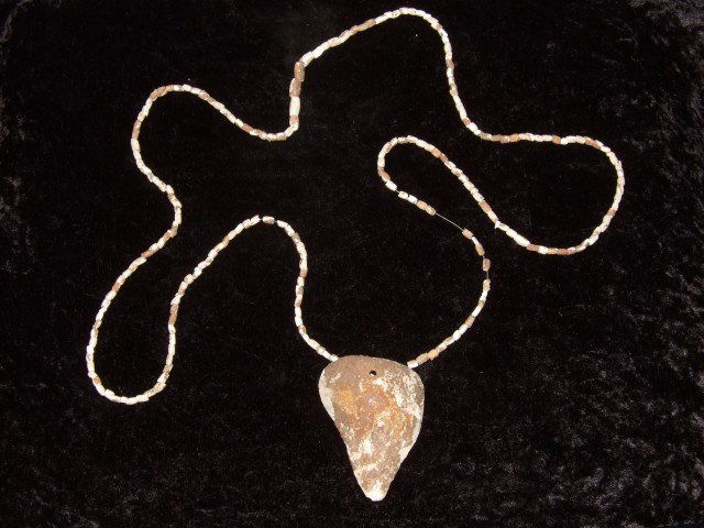 Very fine shell gorget and necklace containing 233: Very fine shell gorget and necklace containing 233 drilled shell beads, found on the Hiwassee Island, Tennessee River, TN. 50" strand.