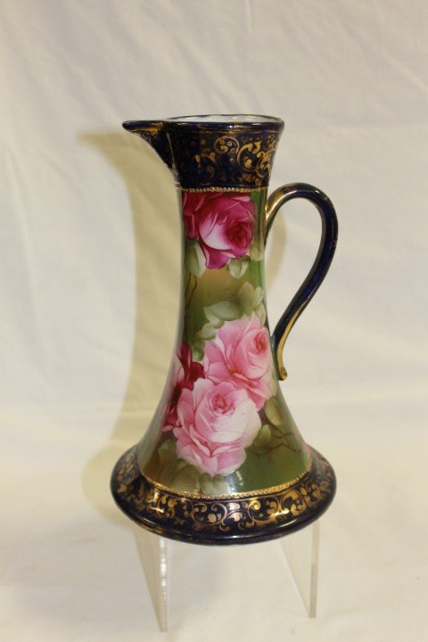 Unmarked Nippon 9 3/4" cobalt and gold decorated p: Unmarked Nippon 9 3/4" cobalt and gold decorated pitcher with rose decorated body, minor gold wear.