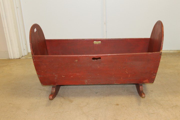 Pleasant Hill, KY Shaker child's cradle in red pa: Pleasant Hill, KY Shaker child's cradle in red paint, with oval cut-outs on side. 37" long, 22 1/2" wide