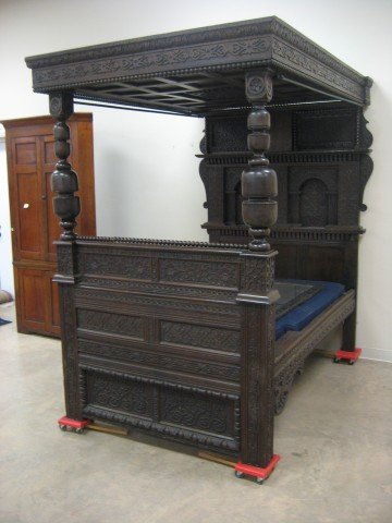 European Elizabethan carved oak bed, reported to have b: European Elizabethan carved oak bed, reported to have been recarved in the Victorian era for the English family "Wilkinson", makers of fine swords and blades. Wilkinson name and dates carved on foot b