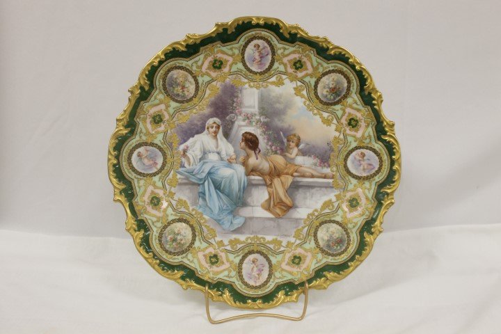 Exceptional 16" W. Guerin Limoges charger signed Dubois: Exceptional 16" W. Guerin Limoges charger signed Dubois with a courting scene with cupid at a marble fountain with a border of four ovals with cupid, four ovals with flowers, and eight heavily decorat