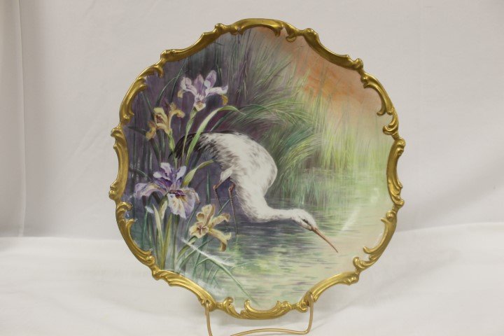 15 3/4" LRH Limoges charger signed Muville with white h: 15 3/4" LRH Limoges charger signed Muville with white heron in high marsh grass with colorful Japanese Iris blossoms. Minor wear.
