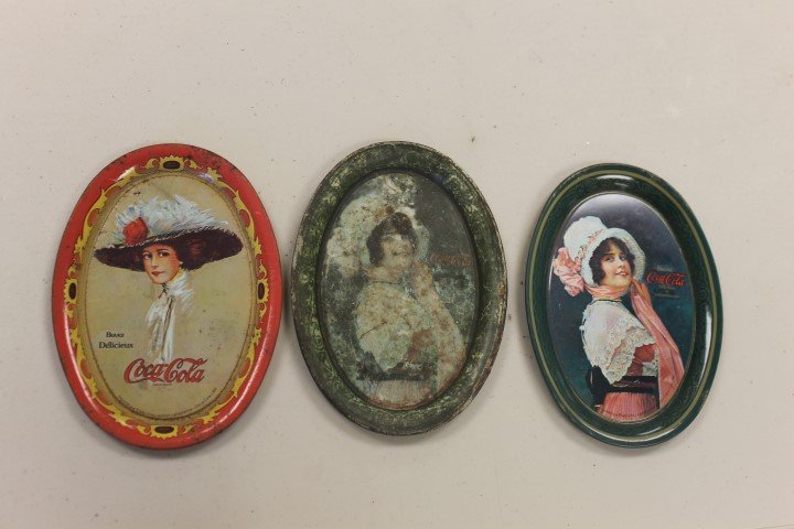 (3) Coca-Cola change trays: 1914 Betty 6": (3) Coca-Cola change trays: 1914 Betty 6" X 4 1/4' with heavy wear, Canadian Betty and Hamilton King Coca-Cola girl trays, both with minor wear.