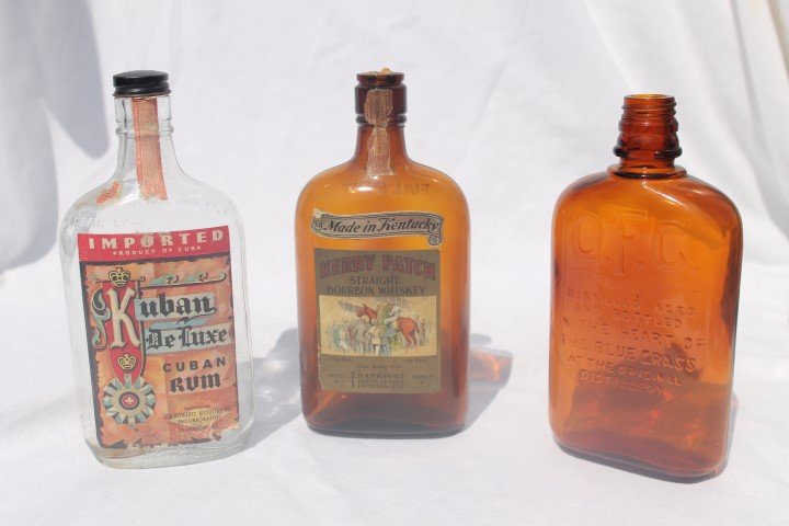 Frankfort, KY pint bottles: Kilbern Deluxe Cuban Rum: Frankfort, KY pint bottles: Kilbern Deluxe Cuban Rum with partial tax stamp; Kerry Patch Straight Bourbon whiskey, amber 1934; O.F.C. amber pint