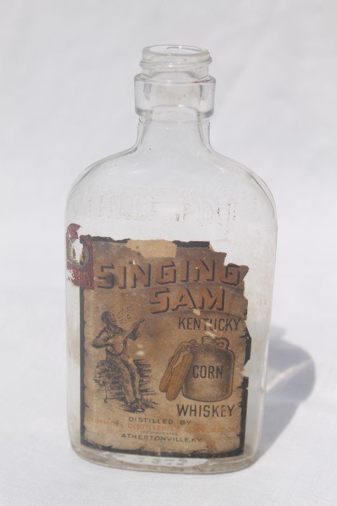 Singing Sam Kentucky Corn Whiskey, Athertonville, KY,: Singing Sam Kentucky Corn Whiskey, Athertonville, KY, half pint, some loss, partial tax stamp.
