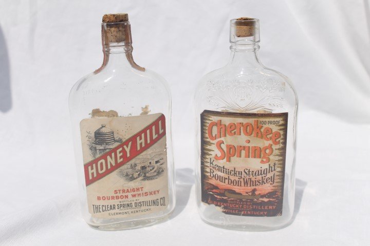 Pint whiskey bottles: Honey Hill Straight Bourbon: Pint whiskey bottles: Honey Hill Straight Bourbon Whiskey, Clermont, KY, partial tax stamp, partial back label; Cherokee Spring Kentucky Straight Bourbon Whisky, Louisville, KY, some loss, with back t