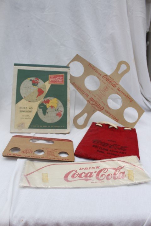 Coca-Cola items: Handle Handy Carrier No. 102A,: Coca-Cola items: Handle Handy Carrier No. 102A, Philadelphia Folding Box Co. - perforated for folding; Pure as Sunlight pad with sticker; white cap; money bag Coca-Cola Bottling Company, Rome, Georgia