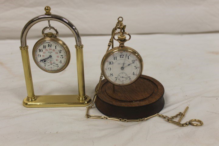 Pocket watches: Elgin 847 23 jewel screw back pocket: Pocket watches: Elgin 847 23 jewel screw back pocket watch, 2", running; Hamilton 21 jewel #156072 screw front watch in a warranted Keystone J. Boss case, with chain and fob marked Simmons. 2 1/8", wi