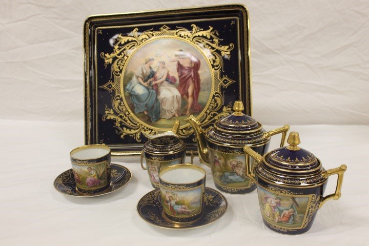 Royal Vienna cobalt cabaret or tea set with heavy gold: Royal Vienna cobalt cabaret or tea set with heavy gold and enamel beading. 12 3/8" classical scene tray signed K. Weh and titled "Schonheit Krant die Tugend"; (2) cup ansd saucer sets signed C. Forste