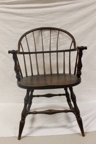 Oak Windsor style arm chair with fitted seat. Missing: Oak Windsor style arm chair with fitted seat. Missing one back spindle. Molded detail on back. 16 1/2" tall at seat, 34 3/4" tall at back