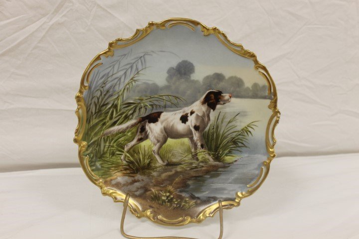 B&H Limoges 10 1/4" charger with outstanding brown and: B&H Limoges 10 1/4" charger with outstanding brown and white pointing dog by a lake, signed T. Golse. Partial back tag. Gold trim with minor wear.